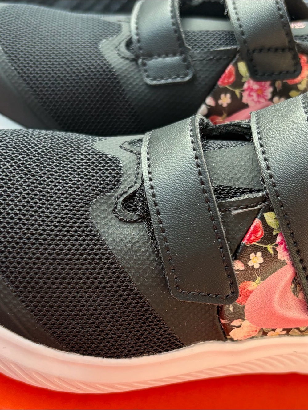 Nike Kids Black Sneakers with Pink Floral Accent